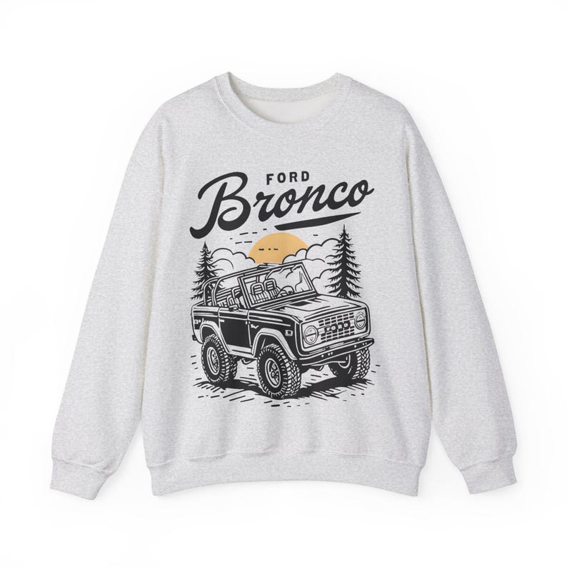 The Ford Bronco Adventure Sweatshirt exudes a sense of adventure and ruggedness, perfect for outdoor enthusiasts and fans of the iconic vehicle. This cozy sweatshirt is made with a medium-heavy fabric blend of 50% cotton and 50% polyester, providing