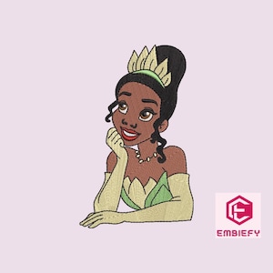 May include: Embroidered design of a cartoon princess with brown skin, green dress, and a gold crown. She is smiling and looking to the right.