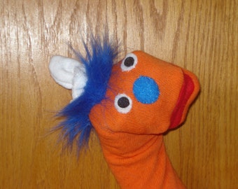 orange long sock puppet theater perform interactive