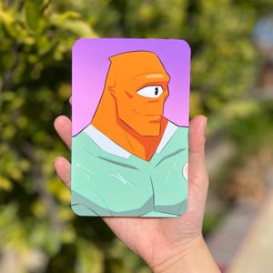 May include: A cartoon illustration of a one-eyed, orange-skinned character wearing a green and white shirt. The character has a friendly expression and is looking to the right.