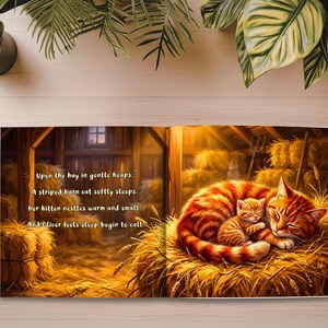 May include: A children's book illustration depicts a barn scene with a sleeping orange tabby cat and kitten nestled in hay. The text reads, "Upon the hay in gentle heaps. A striped barn cat softly sleeps. Her kitten nestles warm and small."