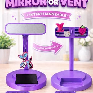 May include: Purple interchangeable mirror or vent stand with decorative attachments. The mirror stand has a dog-shaped charm, while the vent stand features a strawberry and a Hello Kitty charm. The text reads "CHOOSE MIRROR OR VENT" and "INTERCHANGEABLE!"