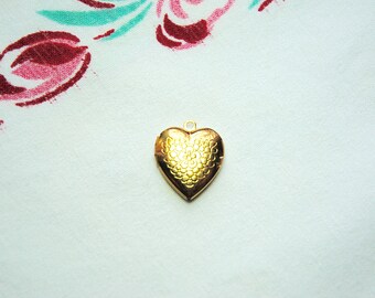 1960s gold heart locket, opens for photos, engraved floral front, marked Japan