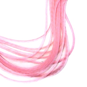 May include: A bundle of pink yarn, soft and fluffy, ready for knitting or crocheting.