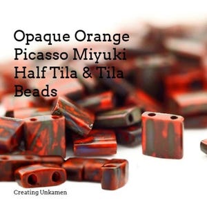 May include: Opaque orange Picasso Miyuki Half Tila & Tila beads. The beads are square shaped and have a mottled, marbled appearance.