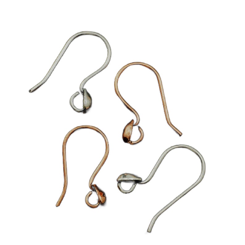 May include: Four silver and gold earring hooks with a teardrop-shaped loop at the end. The hooks are arranged in a scattered pattern on a white background.