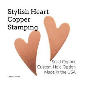 May include: Two copper heart shapes with a slightly rounded edge. The text "Solid Copper Custom Hole Option Made in the USA" is below the hearts.