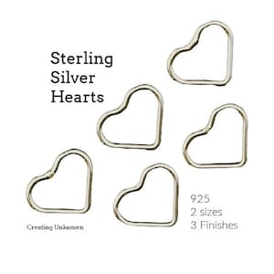 May include: Five sterling silver heart-shaped hoops. The text "Sterling Silver Hearts" is at the top of the image. The text "925, 2 sizes, 3 finishes" is at the bottom of the image.