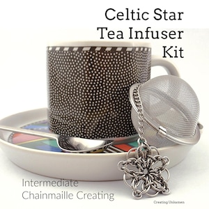 May include: A tea infuser kit with a Celtic star chainmaille design. The kit includes a stainless steel mesh infuser, a decorative star charm, a dotted mug, a saucer, and a spoon. Text on the image reads "Celtic Star Tea Infuser Kit" and "Intermediate Chainmaille Creating."