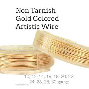 May include: A white ceramic mug with a black handle and the text "But First, Coffee" in a bold, black font. The mug is set against a blurred background, suggesting a cozy setting.