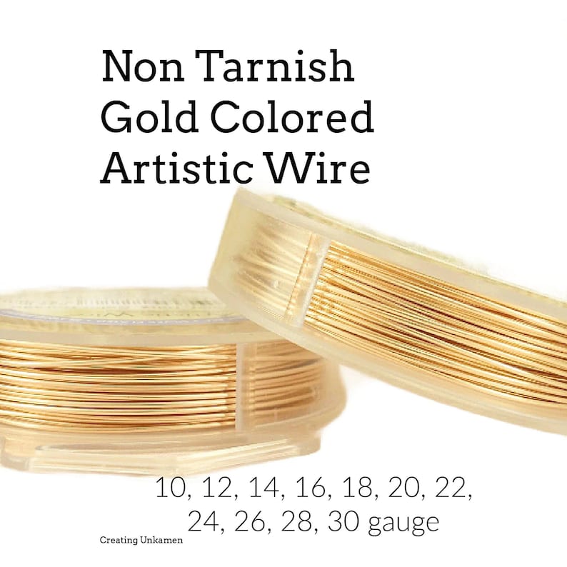 May include: Non Tarnish Gold Colored Artistic Wire coiled on two clear plastic spools. The text reads Non Tarnish Gold Colored Artistic Wire and lists gauges 10, 12, 14, 16, 18, 20, 22, 24, 26, 28, 30 gauge and Creating Unkamen.