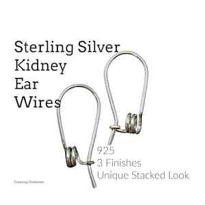 May include: Two sterling silver kidney ear wires with a unique stacked look. The image includes text that reads "Sterling Silver Kidney Ear Wires", "925", "3 Finishes", and "Unique Stacked Look".