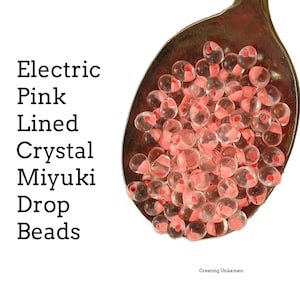 Cuentas de cristal con forma de gota y forro rosa eléctrico Miyuki DPF-01