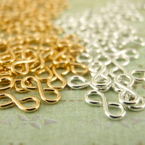 25 maglie Infinity Figure Eight - Versione I - 7 mm x 3 mm - Placcato argento, Placcato oro - Garanzia al 100%