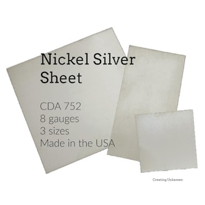 May include: Three sheets of nickel silver in different sizes. The largest sheet has text that reads "Nickel Silver Sheet", "CDA 752", "8 gauges", "3 sizes", and "Made in the USA". The sheets are a light, neutral colour.