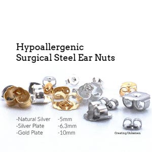 May include: Assortment of hypoallergenic surgical steel ear nuts in natural silver, silver plate, and gold plate finishes. The ear nuts are available in three sizes: 5mm, 6.3mm, and 10mm. The text "Creating Unkamen" is visible in the bottom right corner of the image.