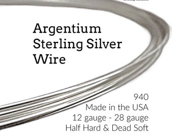May include: Close-up of Argentium Sterling Silver wire. The image shows several strands of shiny, silver-colored wire. Text on the image reads "Argentium Sterling Silver Wire", "940", "Made in the USA", "12 gauge - 28 gauge", and "Half Hard & Dead Soft".