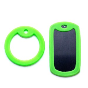 May include: Two green dog tags, one with a round ring and the other with a rectangular blank space for engraving.