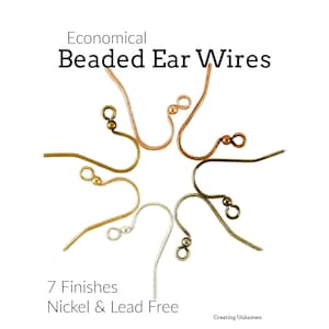 May include: Seven metal ear wires with beads, arranged in a circular pattern. The text reads: Economical Beaded Ear Wires, 7 Finishes, Nickel & Lead Free, Creating Unkamen. The ear wires feature various metallic tones including silver, gold, and copper.