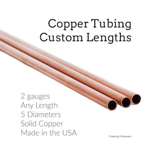 May include: Three pieces of solid copper tubing arranged diagonally. The text reads: Copper Tubing Custom Lengths, 2 gauges, Any Length, 5 Diameters, Solid Copper, Made in the USA, and Creating Unkamen. The copper has a metallic reddish-brown hue.