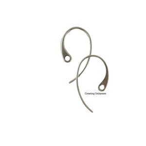 May include: Two silver earring hooks, also known as French hooks, are shown against a white background. The hooks are made of metal and have a smooth, polished finish.