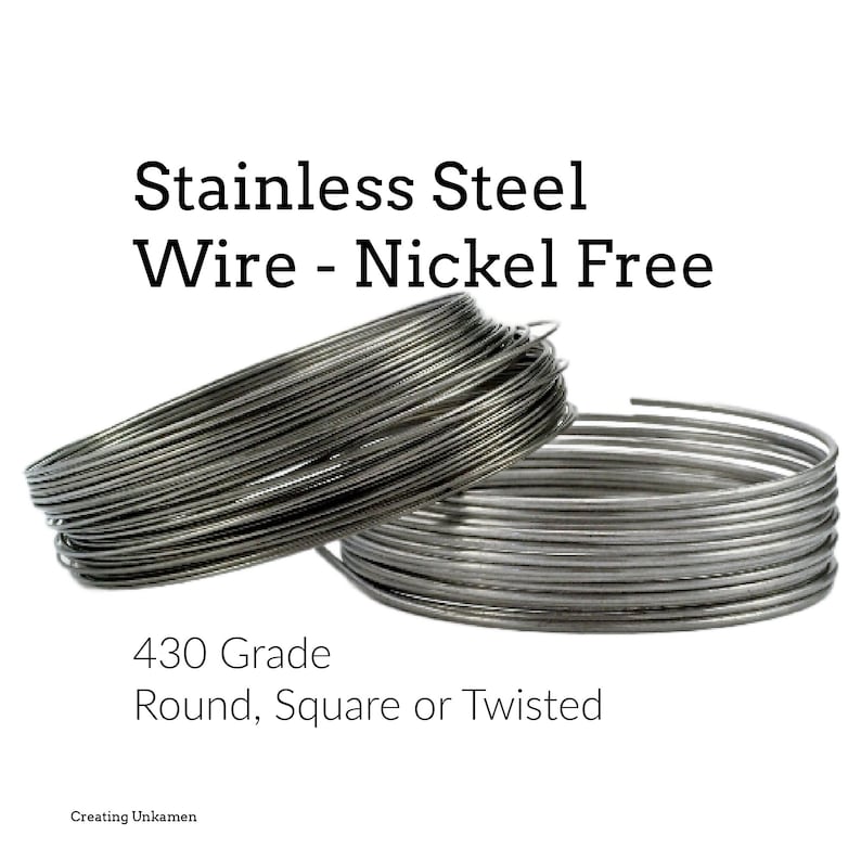 May include: Two coils of silver-colored stainless steel wire. The text reads: Stainless Steel Wire - Nickel Free, 430 Grade, Round, Square or Twisted, Creating Unkamen. The wire is metallic, reflective, and coiled into circular shapes.