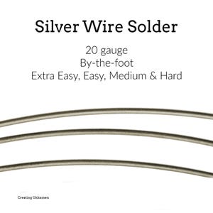 May include: Silver wire solder, 20 gauge, available by the foot. The text on the image indicates it is available in Extra Easy, Easy, Medium & Hard. The image shows three strands of silver wire solder.