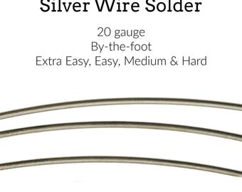 May include: Silver wire solder, 20 gauge, available by the foot. The text on the image indicates it is available in Extra Easy, Easy, Medium & Hard. The image shows three strands of silver wire solder.