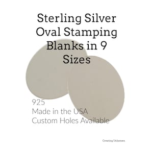 May include: Two smooth, silver-coloured oval stamping blanks. The text reads: Sterling Silver Oval Stamping Blanks in 9 Sizes, 925, Made in the USA, Custom Holes Available, and Creating Unkamen. The metal pieces are flat and feature a matte finish.