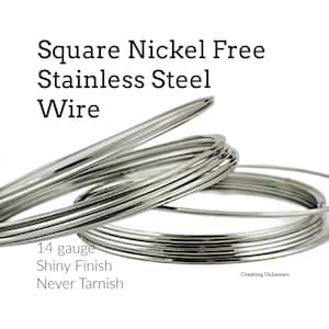 May include: Coils of silver-colored square nickel-free stainless steel wire with a shiny finish. The text reads: Square Nickel Free Stainless Steel Wire, 14 gauge, Shiny Finish, Never Tarnish, Creating Unkamen. The wire is arranged in loops.