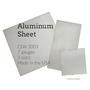 May include: Three rectangular silver-colored aluminum sheets of varying sizes. The largest sheet features black text that reads: Aluminum Sheet, CDA 3003, 7 gauges, 3 sizes, Made in the USA. The smallest text in the bottom right corner reads: Creating Unkamen.