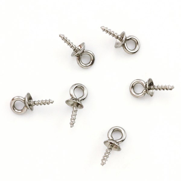 May include: Six silver screw-on eye pins with a small round loop at the top. These are ideal for attaching jewelry findings or charms to projects.
