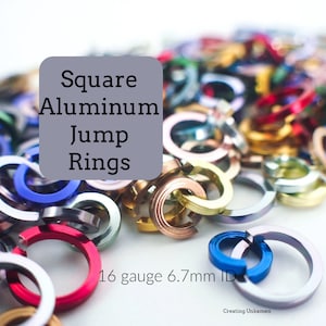 May include: A close-up of a pile of colorful square aluminum jump rings. The rings are 16 gauge and have a 6.7 mm inner diameter.  "Square Aluminum Jump Rings 16 gauge 6.7mm ID" is written in white text on a gray background.
