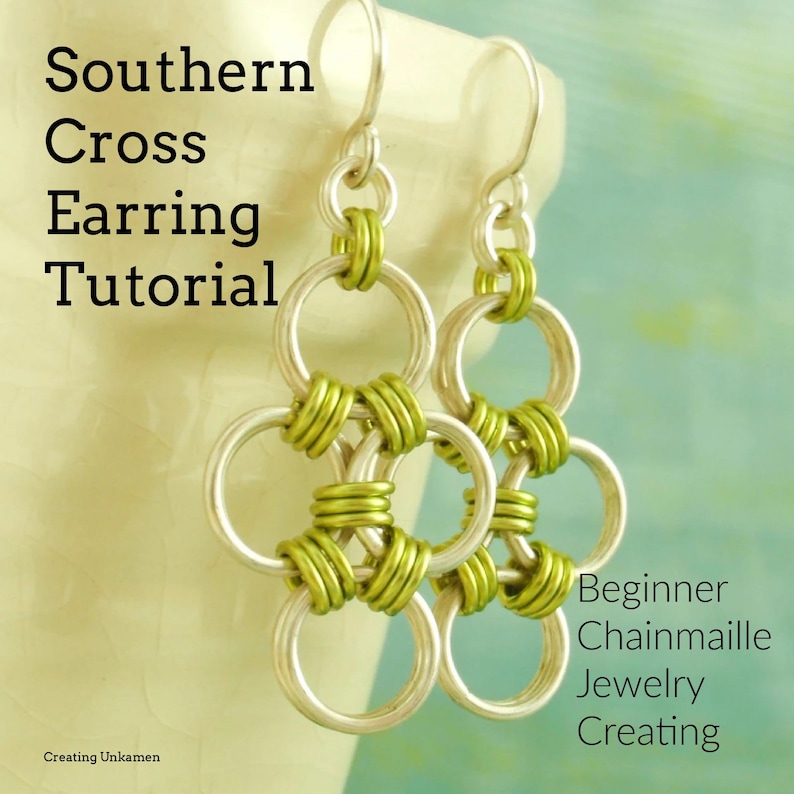 May include: A pair of silver earrings with green chainmail accents. The earrings are in the shape of a Southern Cross, a popular design in jewelry making. Beginner Chainmail Jewelry Creating.
