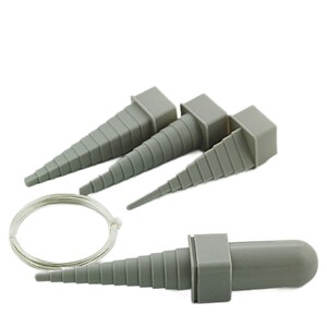 May include: Set of four grey plastic tapered ring mandrels for jewellery making, with a silver wire coil.