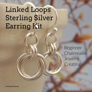 May include: Sterling silver earring kit for beginners. The kit includes two silver earring hooks and enough silver jump rings to create linked loop earrings. The earrings are shown on a white surface with a blurred background of a branch.