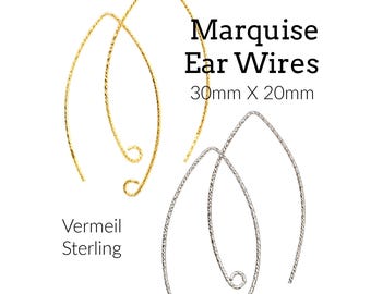 May include: Two pairs of marquise ear wires, one gold vermeil and one sterling silver, each measuring 30mm x 20mm. The wires feature a textured surface and a curved, pointed shape with a small loop at the end for jewelry making components.