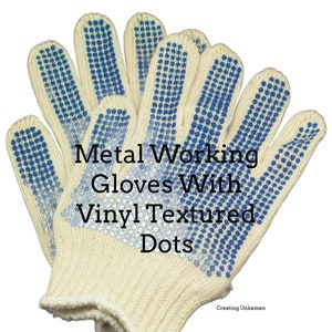 May include: A pair of beige work gloves with blue vinyl textured dots. The gloves are made of a knitted fabric and have a textured grip. Metal Working Gloves With Vinyl Textured Dots.