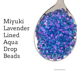 Perlas de vidrio con forma de gota color aguamarina con revestimiento de lavanda DPF-47 de Miyuki