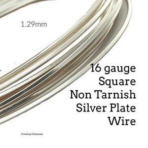 May include: A coil of 16 gauge square non-tarnish silver plate wire measuring 1.29mm. The metallic silver wire is arranged in a circular loop, showcasing its square profile and reflective surface. The text 1.29mm and 16 gauge Square Non Tarnish Silver Plate Wire is visible.