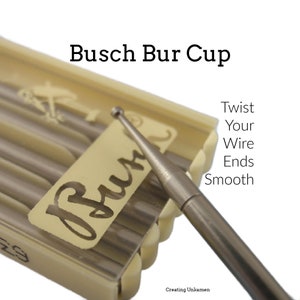 May include: A close-up of a silver metal bur cup with a round tip. The bur cup is in a plastic case with the word "Busch" printed on it. The text "Twist Your Wire Ends Smooth" is printed on the right side of the image.