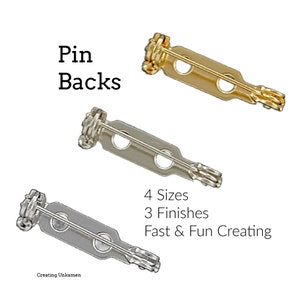 May include: Three different pin backs in gold, silver, and gunmetal finishes. The pin backs are all the same shape and size, with a small loop at the top and two holes on either side. The text "4 Sizes 3 Finishes Fast & Fun Creating" is printed below the pin backs.