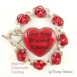 May include: A red and silver chainmail bracelet with a red heart charm that says "Love Knot Bracelet Tutorial". The bracelet is made with a beginner-friendly technique.