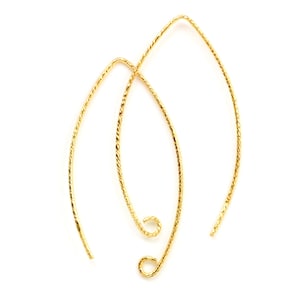 May include: A pair of gold-toned, twisted wire earring hoops.