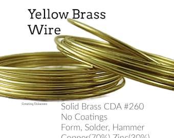 May include: Coils of yellow brass wire with a metallic gold finish. The text reads: Yellow Brass Wire, Creating Unkamen, Solid Brass CDA #260, No Coatings, Form, Solder, Hammer, Copper(70%) Zinc(30%). The wire is smooth, round, and flexible.