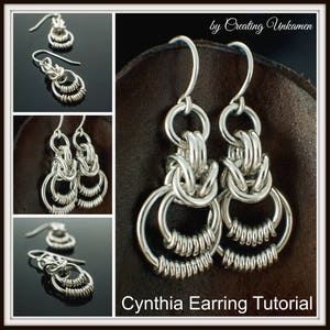 May include: A pair of silver earrings with a delicate, intricate design. The earrings are made of multiple interconnected rings, creating a unique and stylish look. The earrings are hanging from a simple hook.