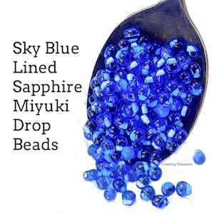 Cuentas de semillas con forma de gota de zafiro con líneas de color azul cielo DPF-29 de Miyuki