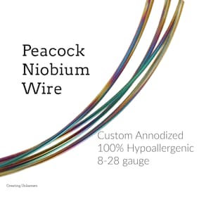 May include: Three strands of iridescent peacock niobium wire in various gauges. Custom anodized, 100% hypoallergenic, 8-28 gauge. Creating Unkamen.