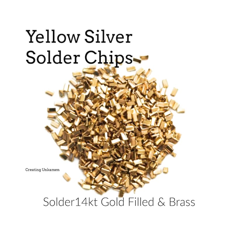 Puede incluir: Un mont&oacute;n de peque&ntilde;as virutas de soldadura de color dorado, etiquetadas como "Yellow Silver Solder Chips" y "Solder 14kt Gold Filled & Brass".