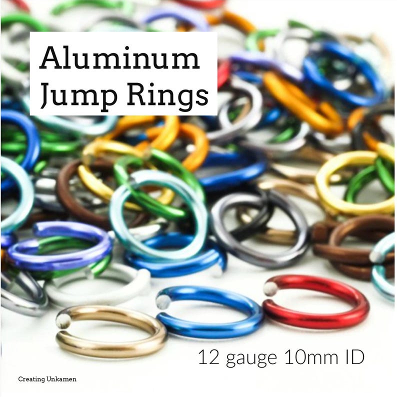May include: A close-up of a pile of colorful aluminum jump rings. The rings are 12 gauge and have an inner diameter of 10mm. The rings are in various colors, including red, blue, green, yellow, and silver.